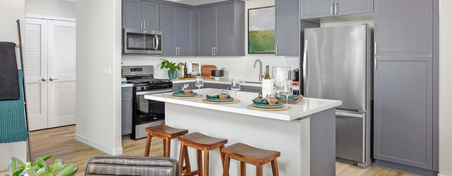 a kitchen with a table and chairs