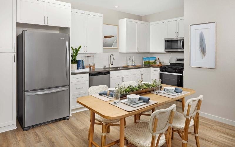 a kitchen with a table and chairs