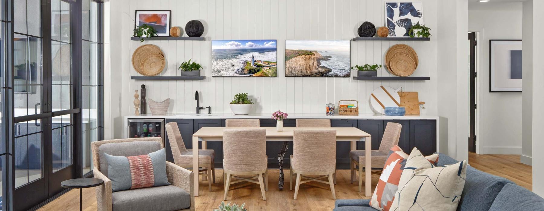a living room with a large table and chairs