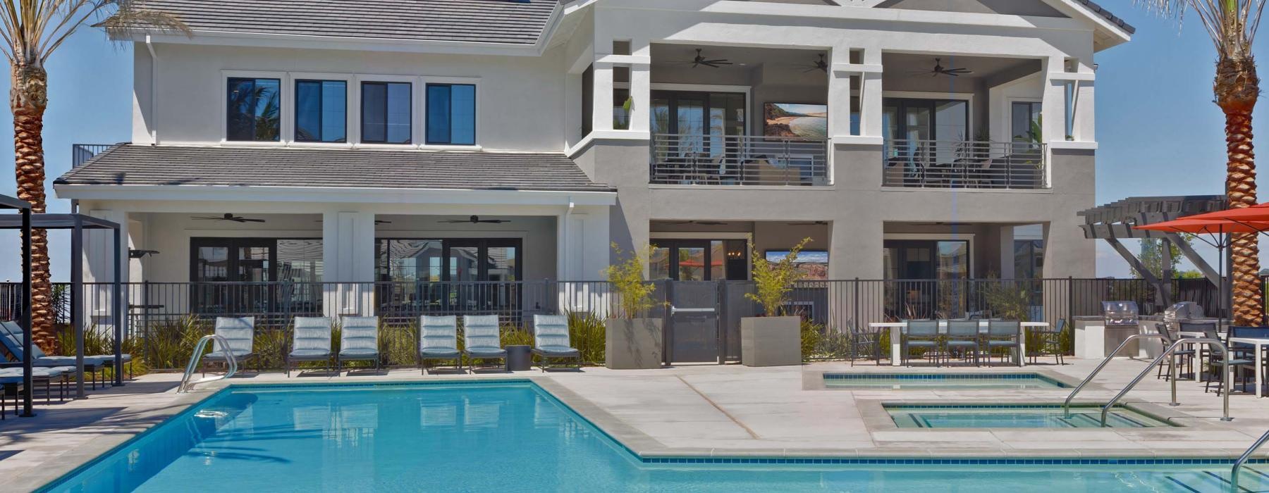 a large white house with a pool